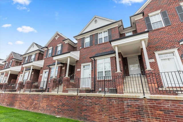 view of front of home featuring brick siding