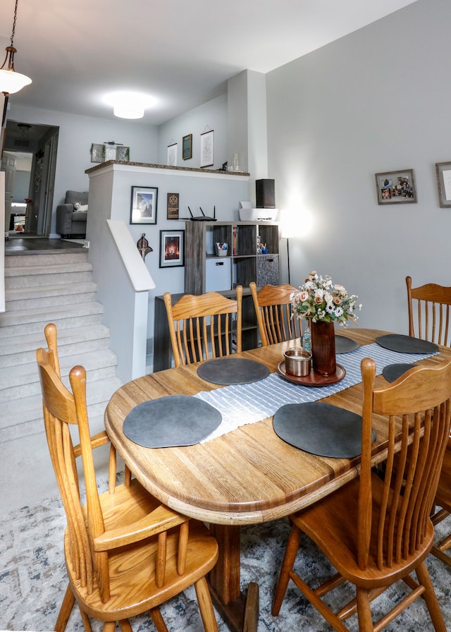dining room featuring stairway