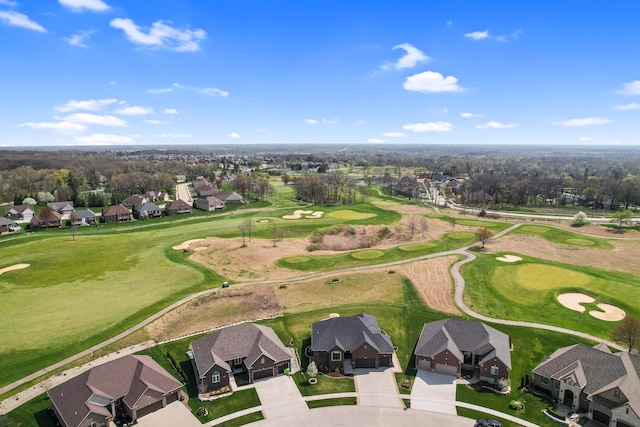 drone / aerial view with a residential view and golf course view