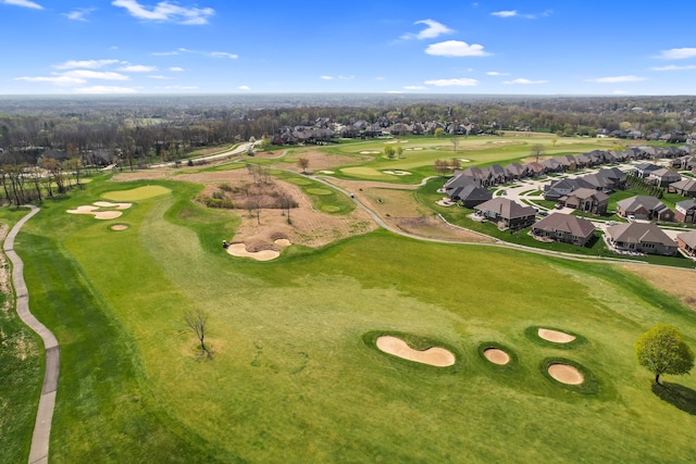 drone / aerial view with a residential view and golf course view