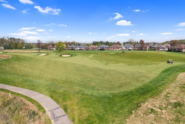 surrounding community with a residential view and golf course view