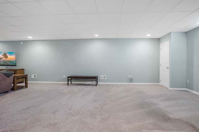 finished basement with carpet floors, baseboards, and visible vents