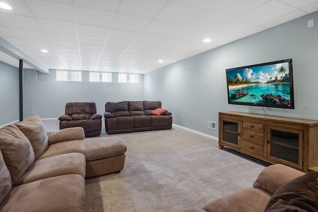 living room featuring visible vents, recessed lighting, baseboards, a drop ceiling, and carpet flooring