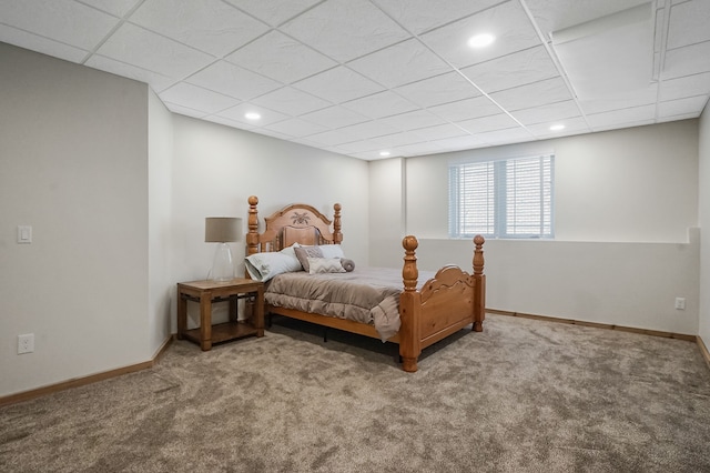carpeted bedroom with recessed lighting, baseboards, and a drop ceiling