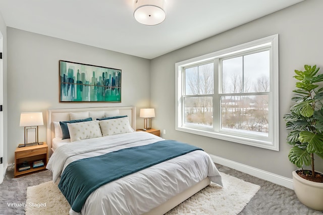 bedroom featuring carpet floors and baseboards