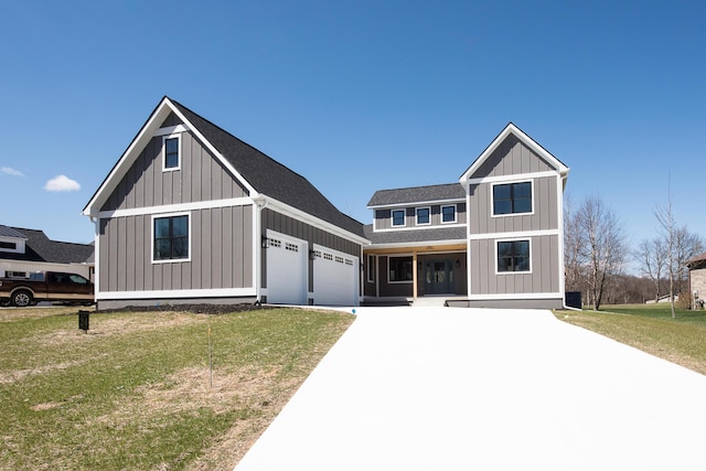 modern farmhouse style home featuring board and batten siding, covered porch, a front yard, a garage, and concrete driveway