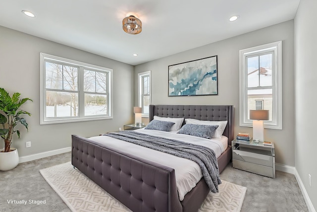 bedroom with baseboards, light carpet, and recessed lighting