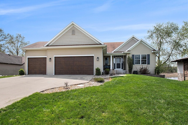 view of front facade with a garage, a front lawn, driveway, and a shingled roof