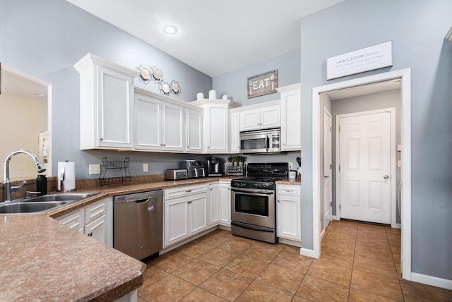 kitchen featuring a sink, white cabinetry, and appliances with stainless steel finishes