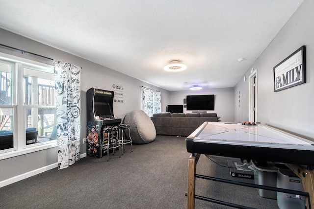 rec room with baseboards, carpet, and a wealth of natural light