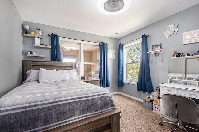 carpeted bedroom featuring baseboards