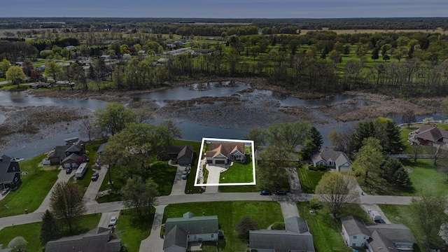 bird's eye view featuring a water view and a residential view