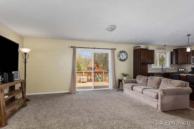 581 Cumings Ct NW, Sparta, MI 49345 - living area with light colored carpet and baseboards