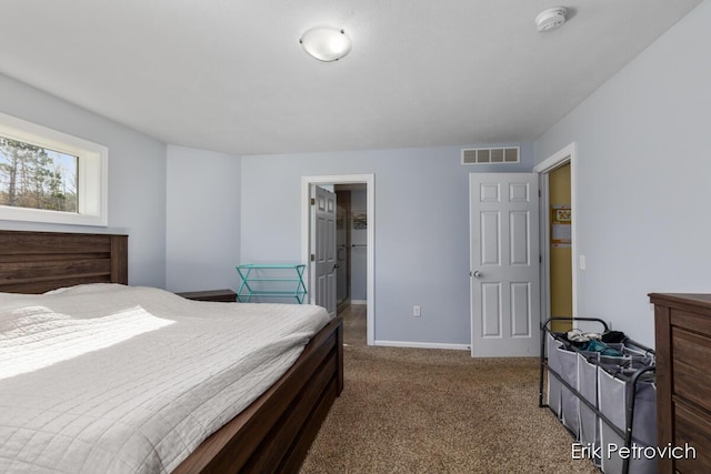 581 Cumings Ct NW, Sparta, MI 49345 - bedroom with carpet floors, baseboards, and visible vents
