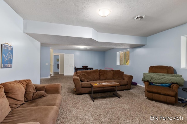 581 Cumings Ct NW, Sparta, MI 49345 - carpeted living room with baseboards, a textured ceiling, and visible vents