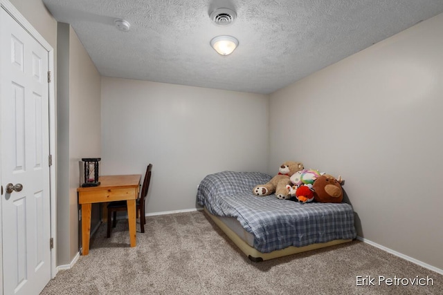 581 Cumings Ct NW, Sparta, MI 49345 - bedroom with carpet floors, a textured ceiling, baseboards, and visible vents