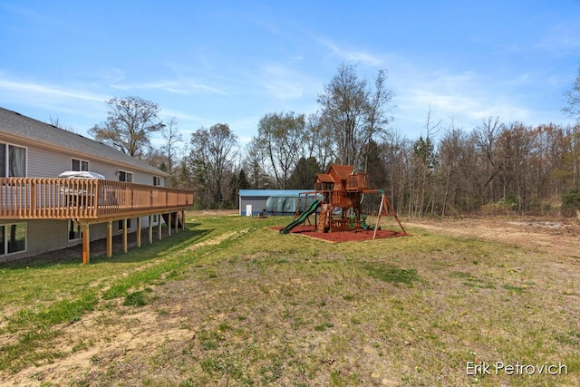 581 Cumings Ct NW, Sparta, MI 49345 - view of yard with a playground and a deck