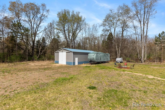 581 Cumings Ct NW, Sparta, MI 49345 - view of yard featuring an outdoor structure and a storage unit