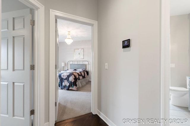 hallway featuring baseboards