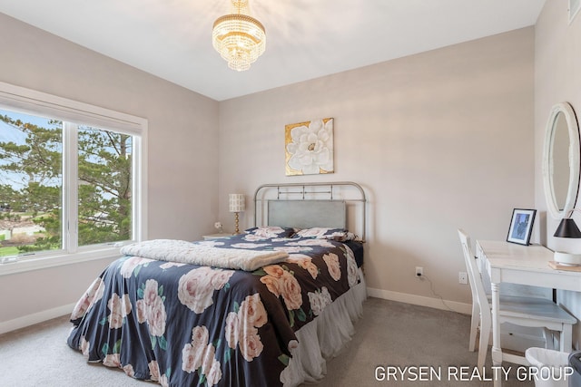 carpeted bedroom with an inviting chandelier, baseboards, and multiple windows