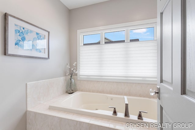 full bath with a whirlpool tub
