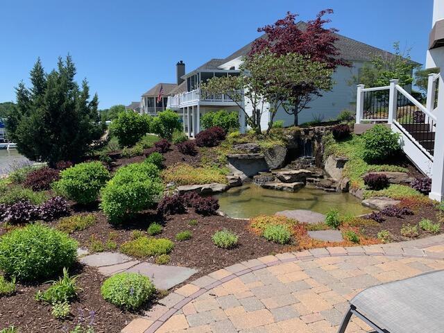 view of yard with a small pond