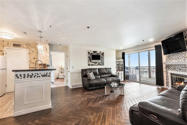 37510 Jefferson Ave Unit 203, Harrison Township, MI 48045 - living area with a large fireplace and recessed lighting