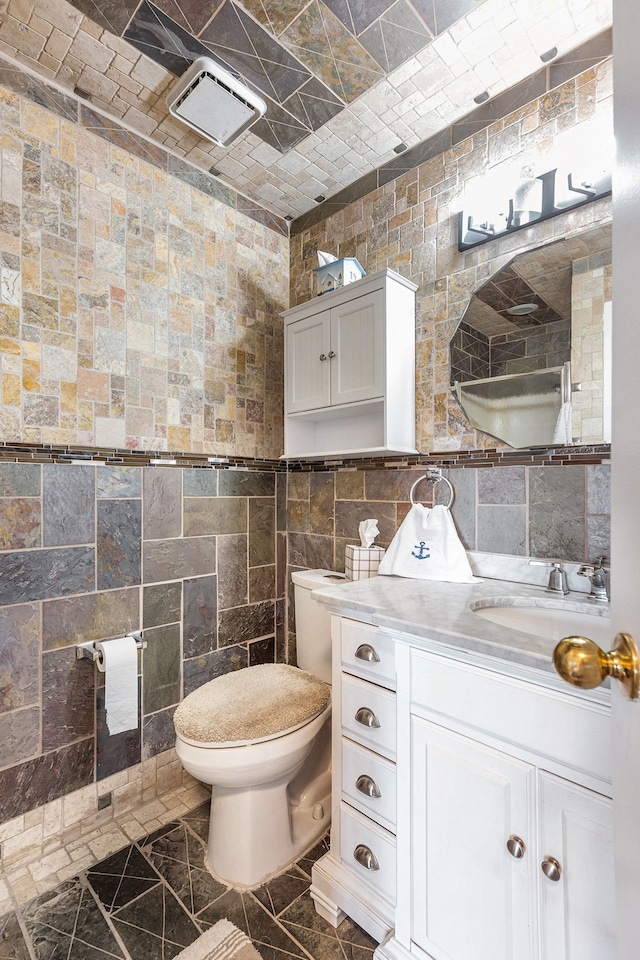 37510 Jefferson Ave Unit 203, Harrison Township, MI 48045 - bathroom with toilet, tile walls, and vanity