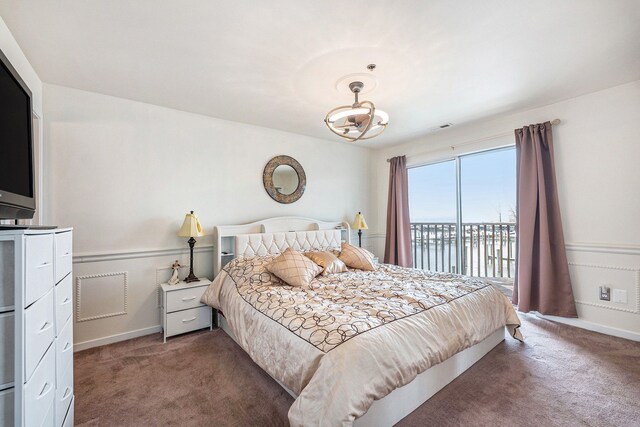 bedroom with access to outside, baseboards, visible vents, and carpet