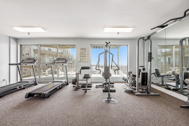 gym featuring a healthy amount of sunlight