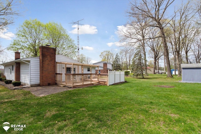 view of yard featuring a wooden deck