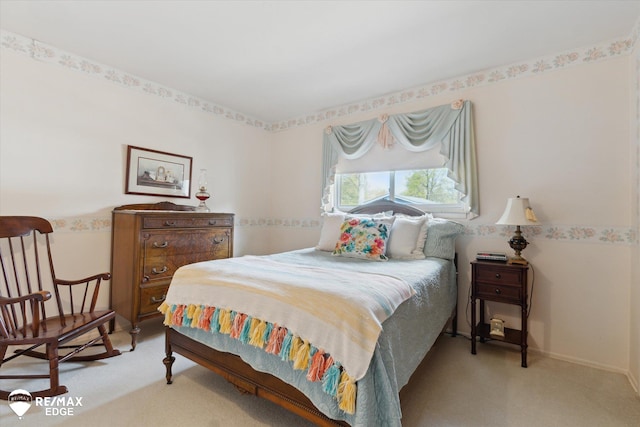 bedroom with light colored carpet