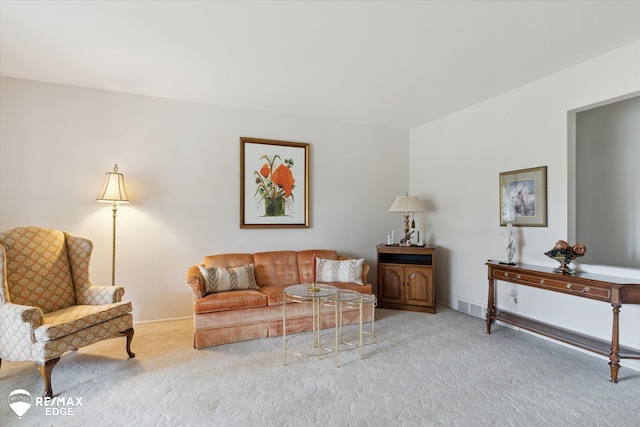 living room with carpet and visible vents