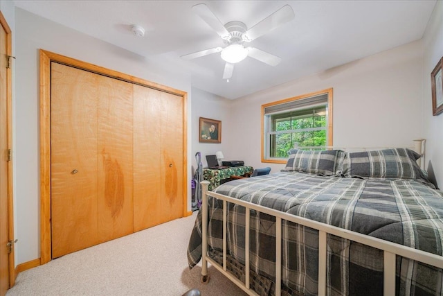 4335 Kings Corner Rd, Glennie, MI 48737 - carpeted bedroom featuring ceiling fan and a closet