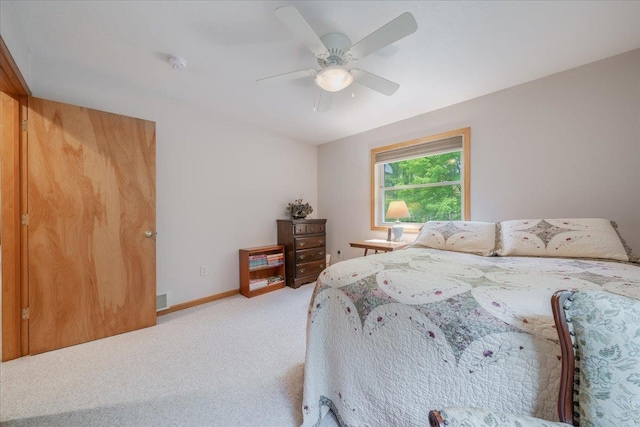 4335 Kings Corner Rd, Glennie, MI 48737 - bedroom featuring baseboards, visible vents, light carpet, and ceiling fan