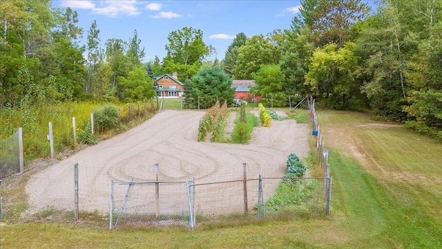 4335 Kings Corner Rd, Glennie, MI 48737 - view of community featuring a yard, fence, and driveway
