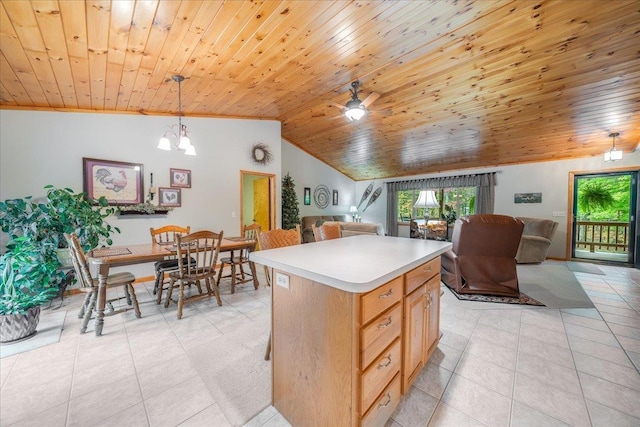 4335 Kings Corner Rd, Glennie, MI 48737 - kitchen featuring wood ceiling, light countertops, light tile patterned floors, lofted ceiling, and open floor plan