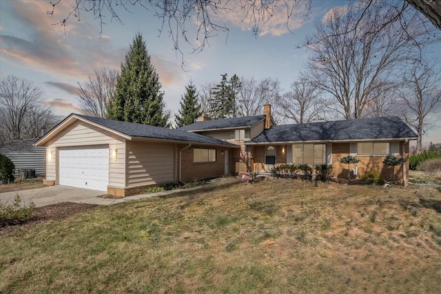 711 Sylvanwood Dr, Troy, MI 48085 - view of front of house featuring driveway, a chimney, a garage, brick siding, and a yard