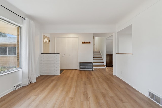 711 Sylvanwood Dr, Troy, MI 48085 - spare room featuring visible vents, light wood finished floors, and a wealth of natural light
