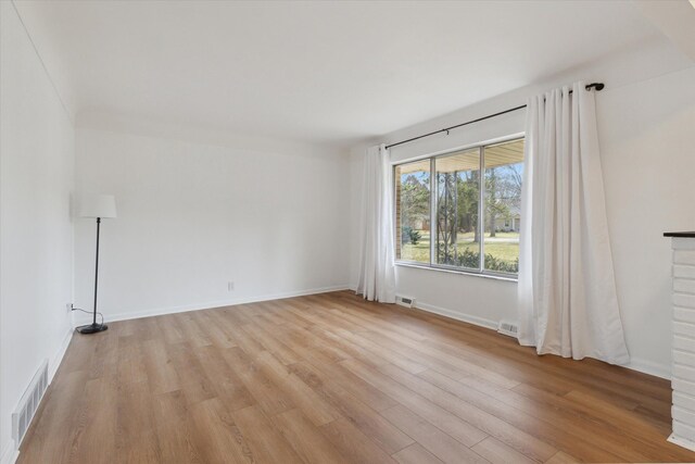 711 Sylvanwood Dr, Troy, MI 48085 - spare room featuring visible vents, light wood-style flooring, and baseboards