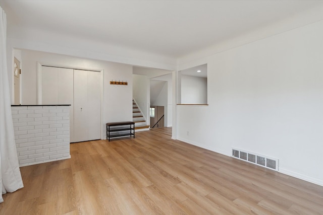 711 Sylvanwood Dr, Troy, MI 48085 - interior space featuring baseboards, visible vents, stairway, and light wood-type flooring