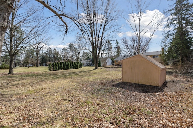 711 Sylvanwood Dr, Troy, MI 48085 - view of yard with a storage shed and an outdoor structure
