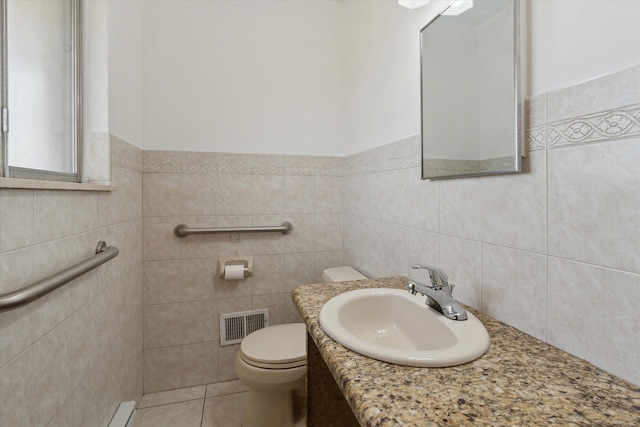 711 Sylvanwood Dr, Troy, MI 48085 - half bath with visible vents, a wainscoted wall, toilet, and tile walls