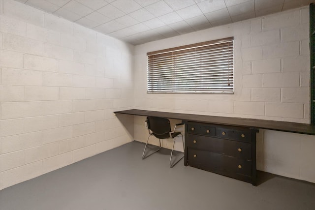 711 Sylvanwood Dr, Troy, MI 48085 - unfurnished office featuring built in study area, concrete block wall, and finished concrete floors