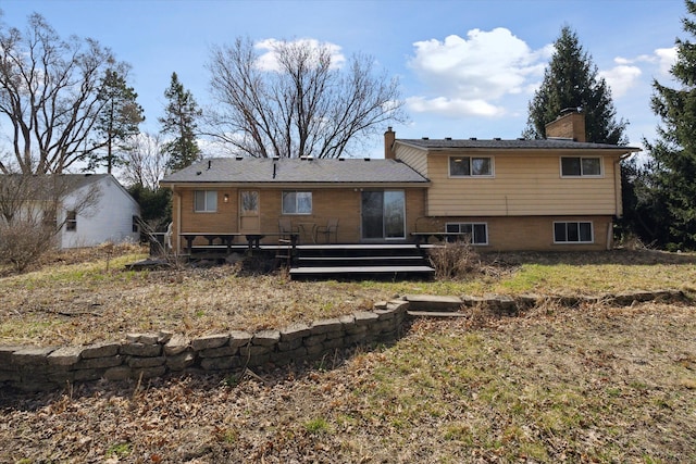 711 Sylvanwood Dr, Troy, MI 48085 - back of house featuring a wooden deck and a chimney