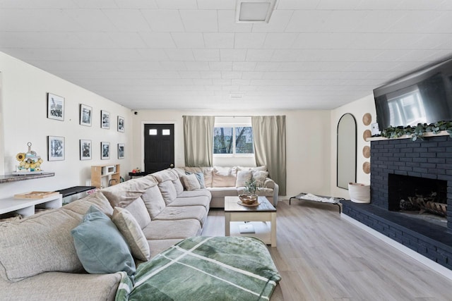 8119 N Dort Hwy, Mount Morris, MI 48458 - living area featuring light wood-type flooring and a fireplace