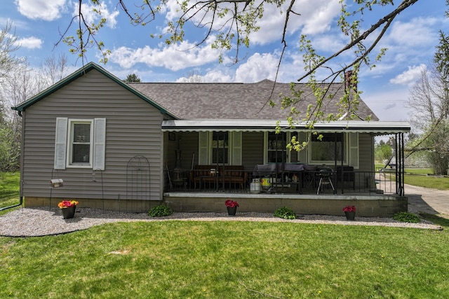 8119 N Dort Hwy, Mount Morris, MI 48458 - back of property featuring a shingled roof, a yard, and a porch