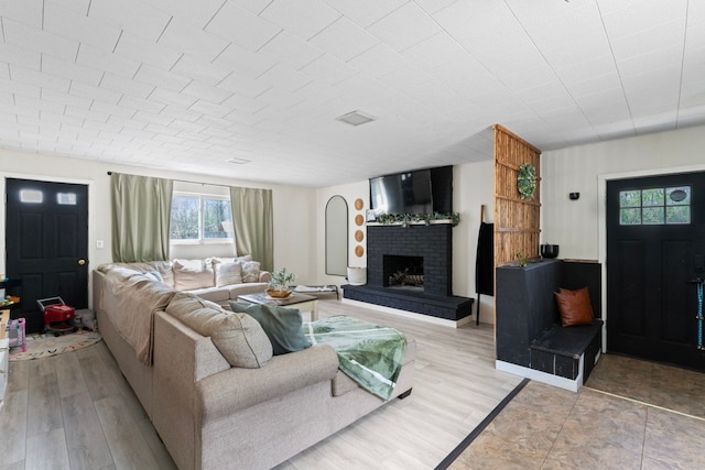 8119 N Dort Hwy, Mount Morris, MI 48458 - living area featuring a fireplace and light wood-style flooring