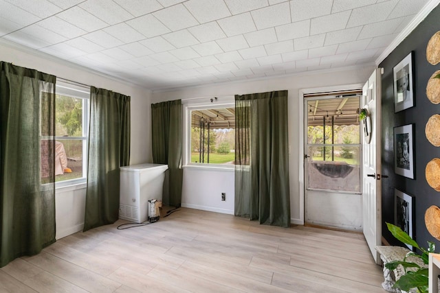 8119 N Dort Hwy, Mount Morris, MI 48458 - entryway featuring light wood-style floors, ornamental molding, and plenty of natural light