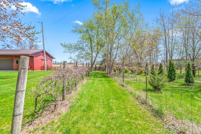 8531 S Waldron Rd, Pittsford, MI 49271 - view of yard featuring fence, a pole building, an outdoor structure, and a garage
